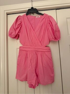 DO+BE Pink Puff Sleeve Romper with cut outs on the side!